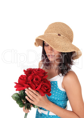 Beautiful woman with bunch of red roses.