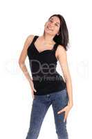 Happy woman standing in jeans.