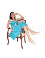 Beautiful woman relaxing in armchair.