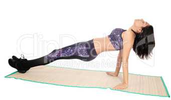 Exercising woman on a mat.