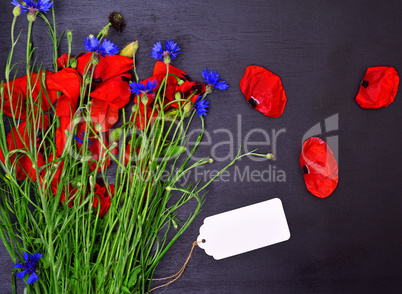 Bouquet of red poppies and blue cornflowers