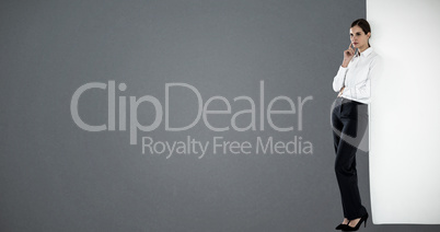 Composite image of thoughtful businesswoman leaning Composite image of thoughtful businesswoman leaning