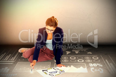 Composite image of high angle view of businesswoman holding chart with icons