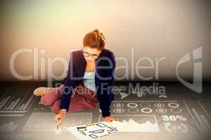 Composite image of high angle view of businesswoman holding chart with icons
