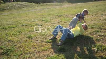 Toddler boy running to beloved grandmother in park