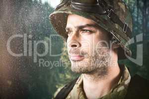 Composite image of close up of thoughtful military soldier