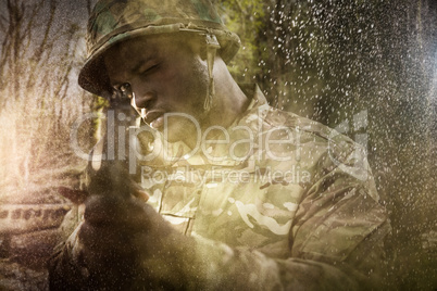 Composite image of close up of soldier aiming with rifle