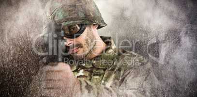 Composite image of portrait of soldier aiming with rifle