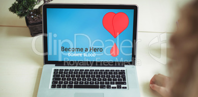 Composite image of become a hero text with heart shape on blue screen