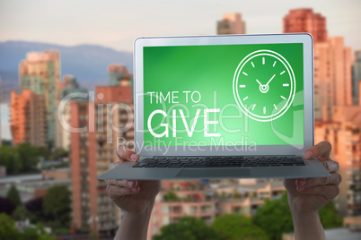 Composite image of cropped hands holding laptop