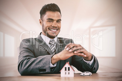 Composite image of estate agent smiling