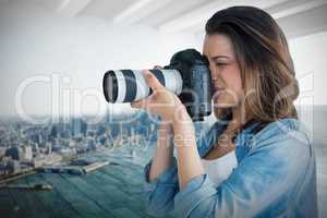 Composite image of young female photographer photographing through camera