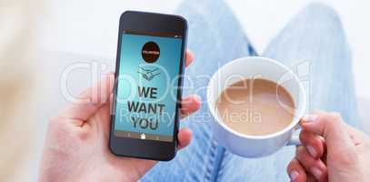 Composite image of woman using her mobile phone and holding cup of coffee