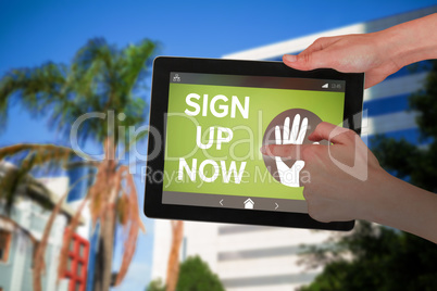 Composite image of hands touching digital tablet against white background