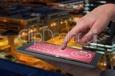 Composite image of businesswoman hand using digital tablet