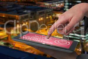Composite image of businesswoman hand using digital tablet