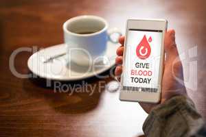 Composite image of give blood today text with icons on screen