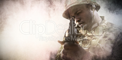 Composite image of close up of soldier aiming with rifle