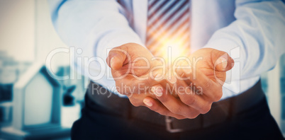 Composite image of midsection of mans hands cupped