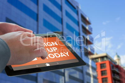 Composite image of businessman touching tablet screen