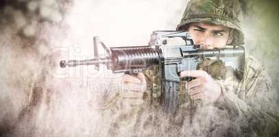 Composite image of soldier aiming with rifle