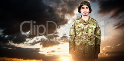 Composite image of portrait of confident military soldier standing