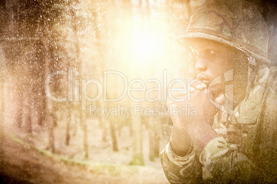 Composite image of close up of thoughtful military soldier