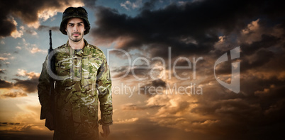 Composite image of portrait of soldier with rifle