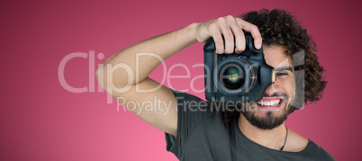 Composite image of happy male photographer photographing through camera