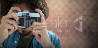 Composite image of close up of man photographing with camera