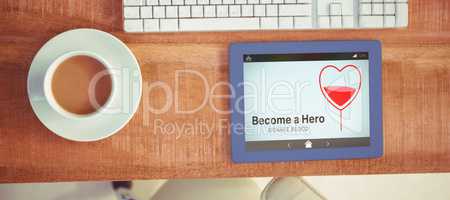 Composite image of become a hero text with heart shape on screen