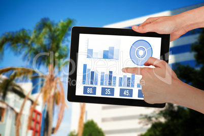 Composite image of hands touching digital tablet against white background