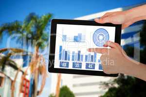 Composite image of hands touching digital tablet against white background