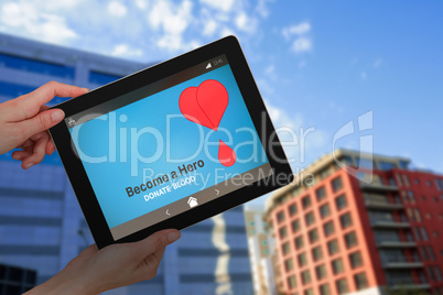 Composite image of hands holding digital tablet against white background