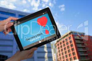 Composite image of hands holding digital tablet against white background