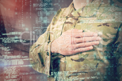 Composite image of mid section of soldier in uniform taking oath