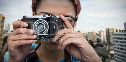 Composite image of close up of woman photographing with camera