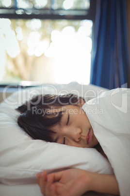 Girl sleeping on the bed in bed room