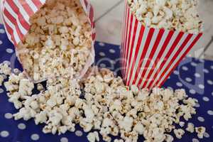 Scattered popcorn on wooden table