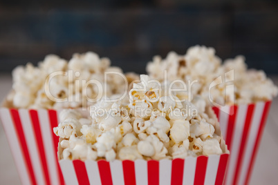 Close-up of popcorn arranged on wooden table