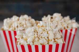 Close-up of popcorn arranged on wooden table