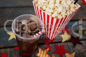 Close-up of popcorn and cold drink