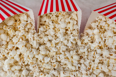 Close-up of scattered popcorn on wooden table