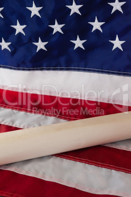 Rolled-up document arranged on American flag