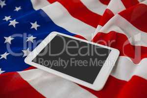 Digital tablet on American flag
