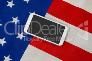 Digital tablet on American flag