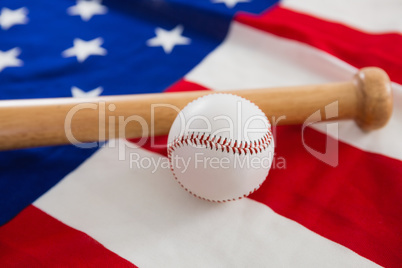 Baseball and baseball bat on an American flag