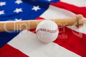 Baseball and baseball bat on an American flag