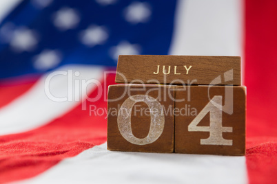 Date blocks on American flag with 4th july theme