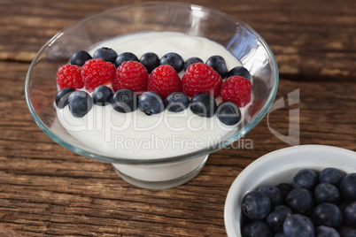 Fruit ice cream and blueberry on wooden table